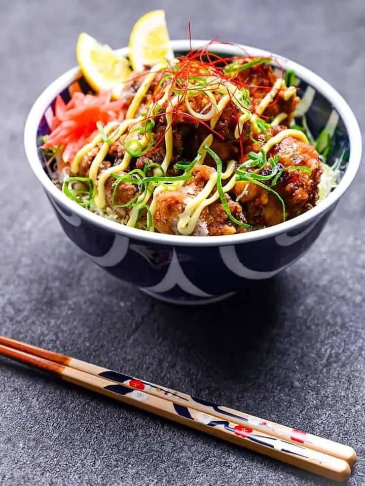 Bowl with crispy topping and fresh herbs