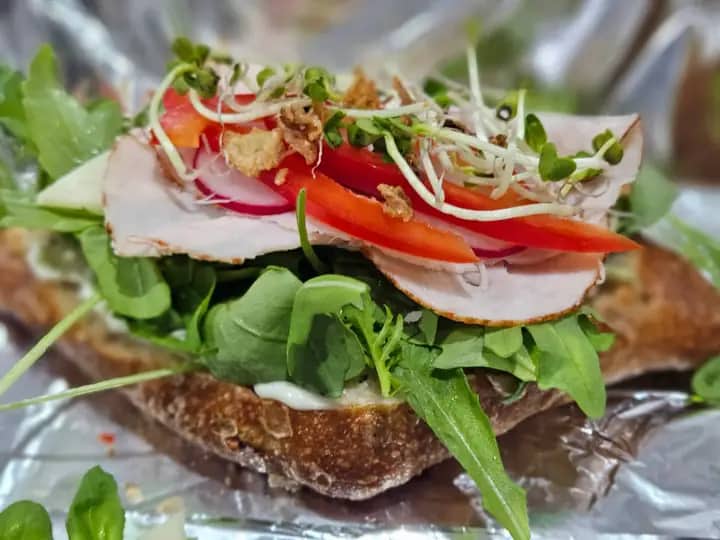 Canape with ham, pepper and fresh sprouts