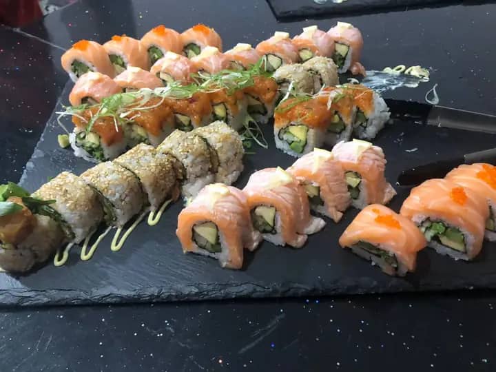 Sushi platter with salmon rolls and sesame rolls